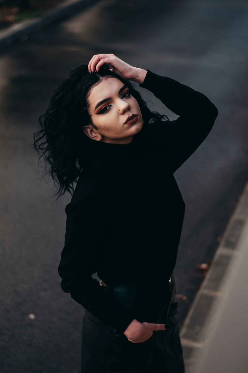 woman in black long sleeve shirt and blue denim jeans