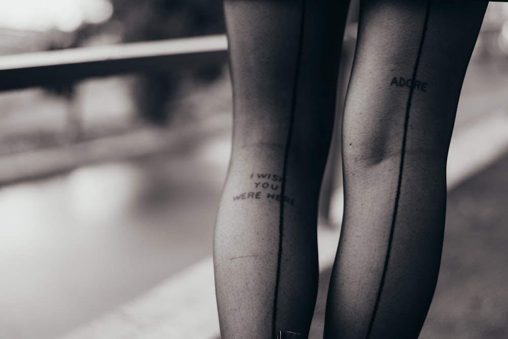 woman in black stockings with tattoo