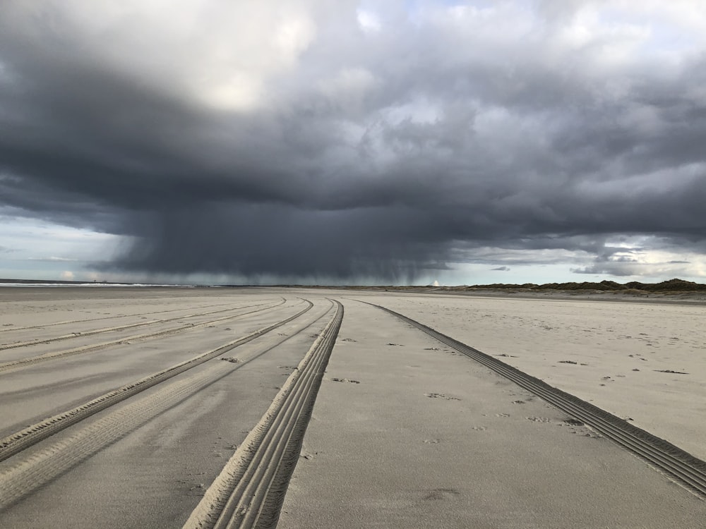 gray asphalt road under gray clouds