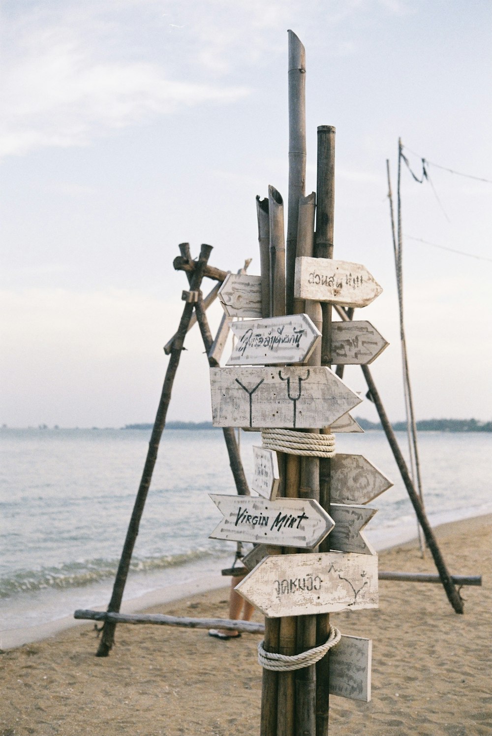 brown wooden cross on beach during daytime