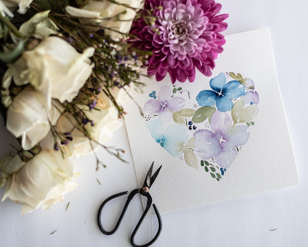 purple and white flowers on white paper
