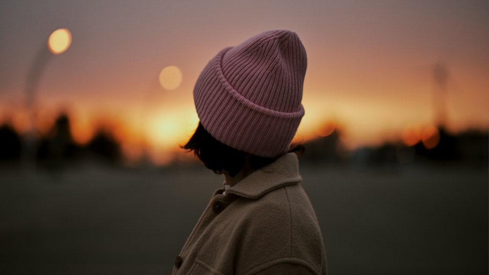 woman in gray knit cap and gray coat