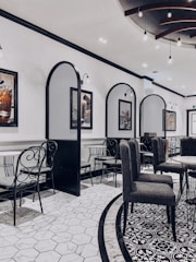 An elegant dining area with contemporary decor and lighting.