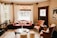 A cozy living room featuring stylish furniture and warm lighting.