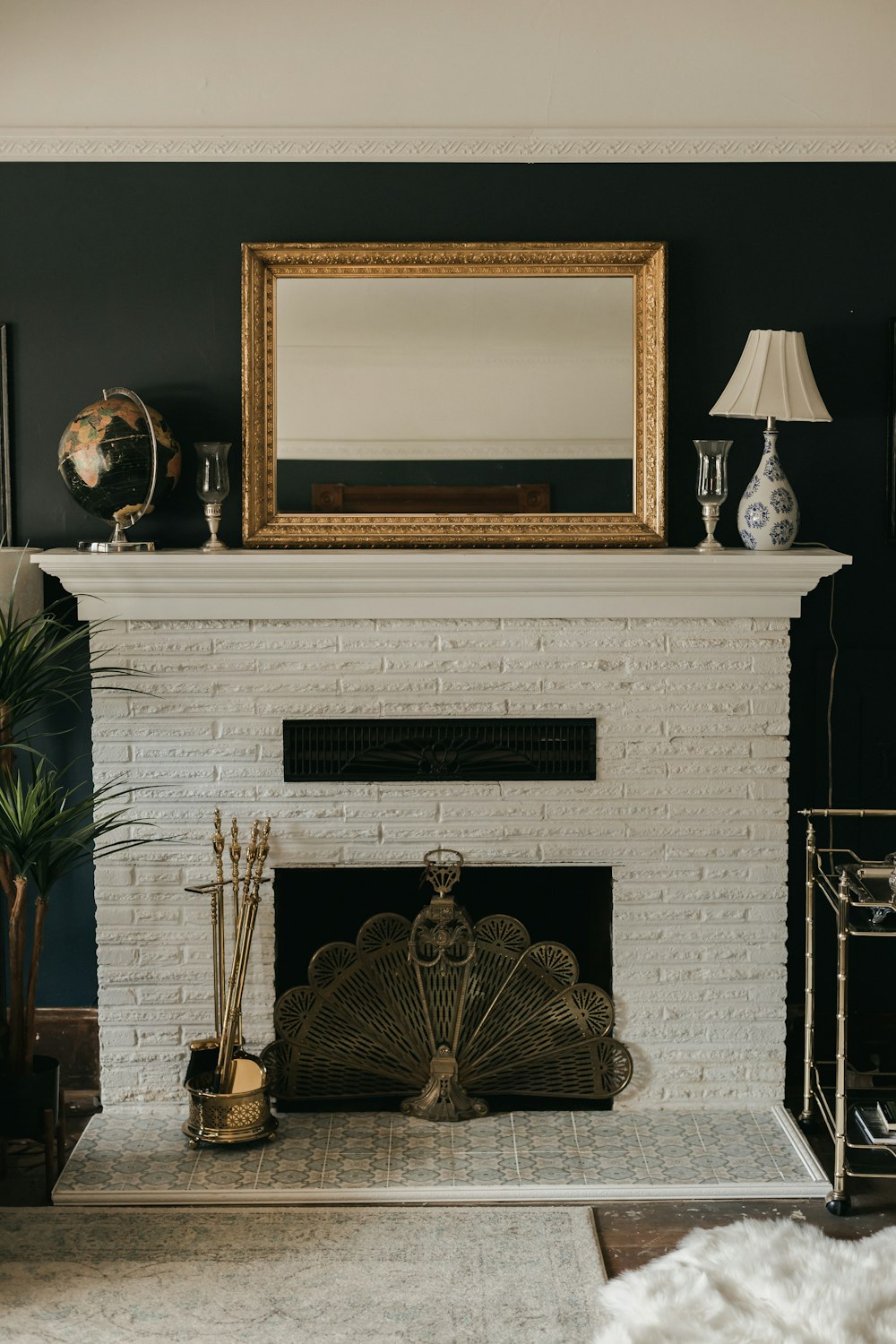white and gold fireplace with brown wooden frame
