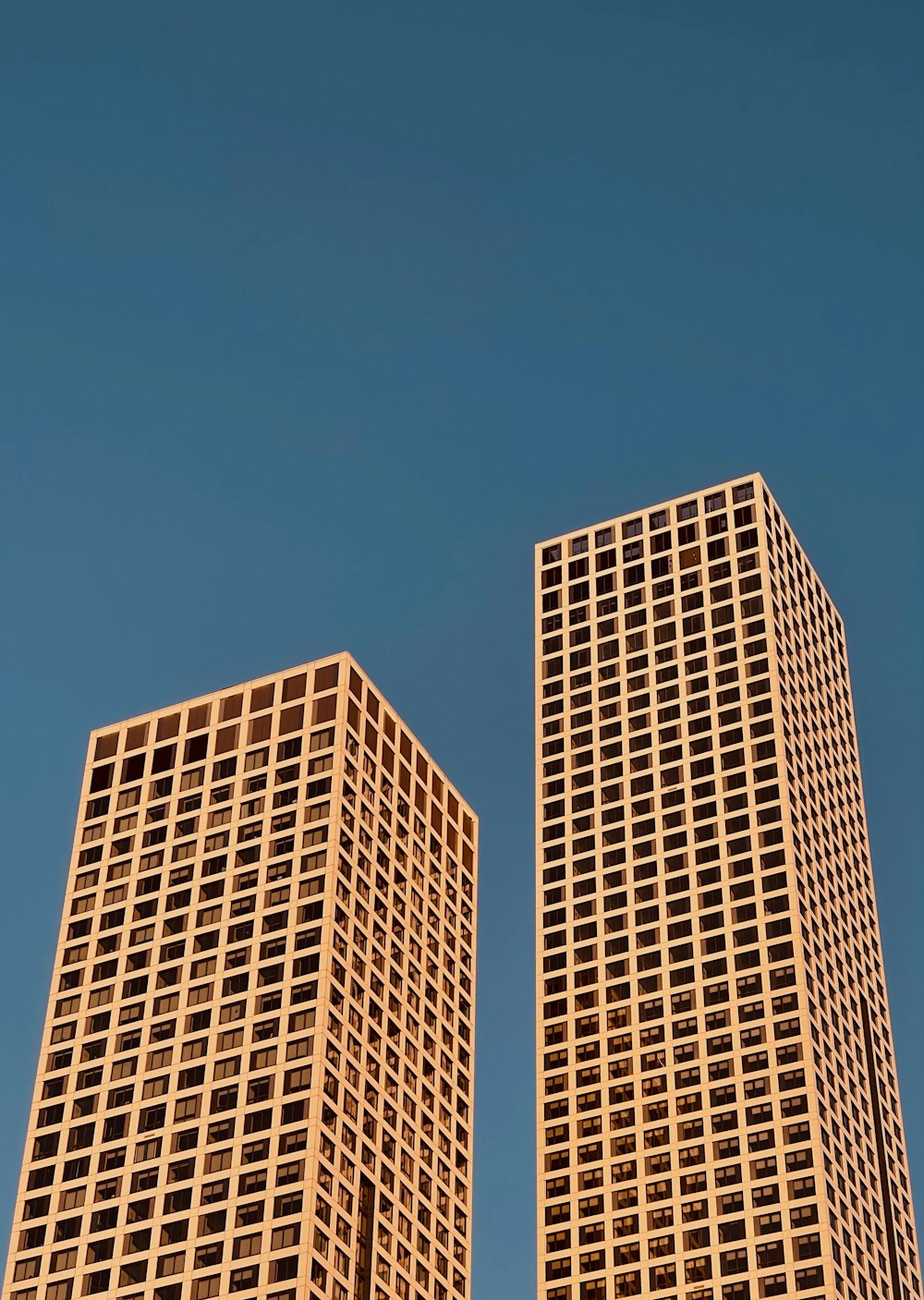 brown concrete building under blue sky during daytime