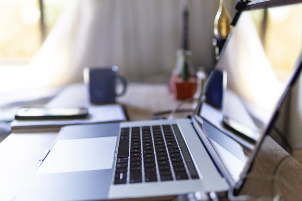 macbook pro on white table