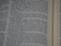 A close-up view of a page from a book, featuring printed text in English. The text is in a column format, with a focus that highlights certain words while others appear slightly blurred.