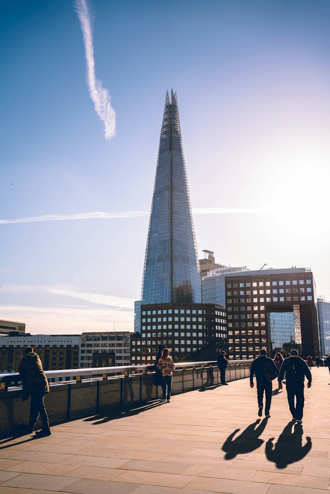 people walking on street near high rise buildings during daytime