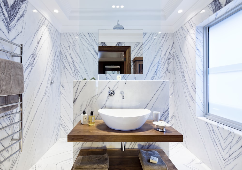 white ceramic sink on brown wooden table