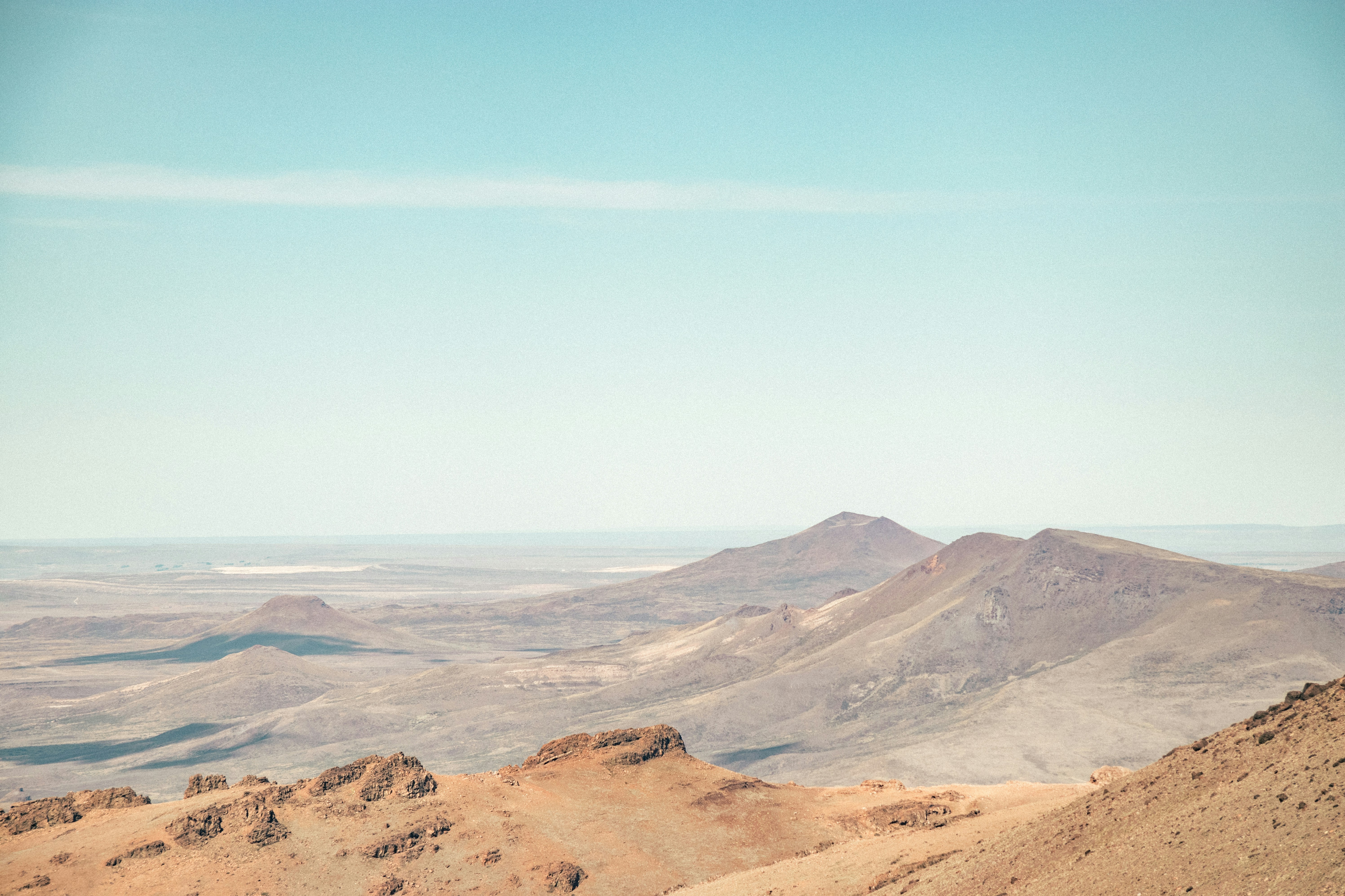 brown and gray mountains under blue sky during daytime