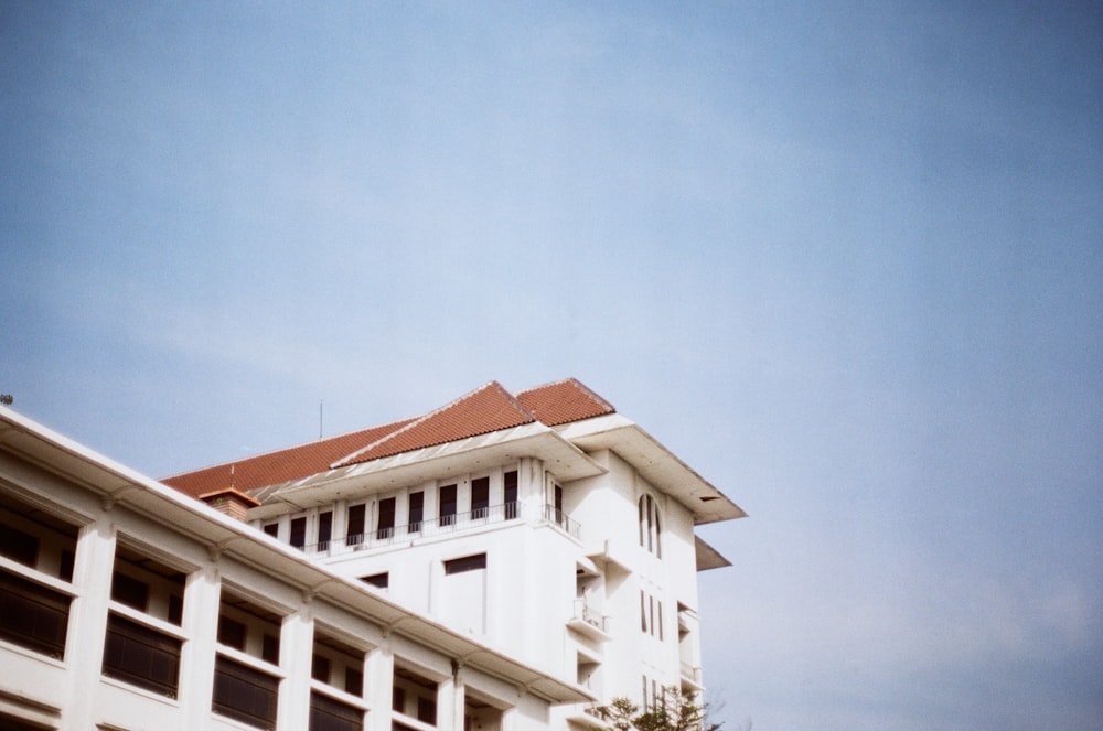 white concrete building under blue sky during daytime