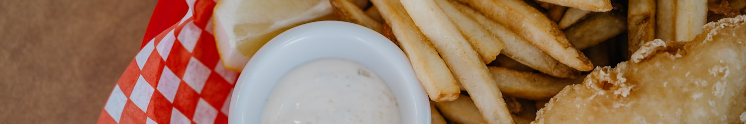 fried food on red and white checkered plate