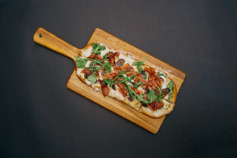 brown wooden chopping board with vegetable salad