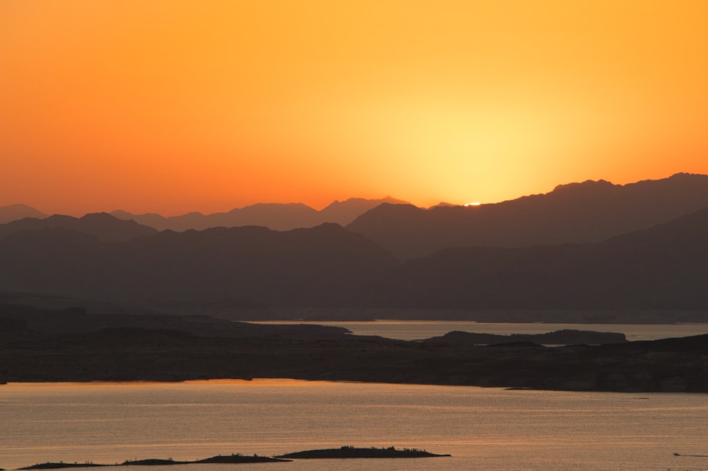 silhouette of mountains during sunset