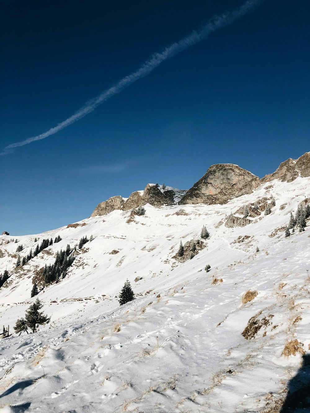 snow covered mountain under blue sky during daytime