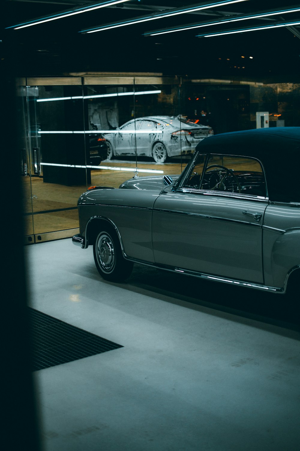 blue classic car in garage