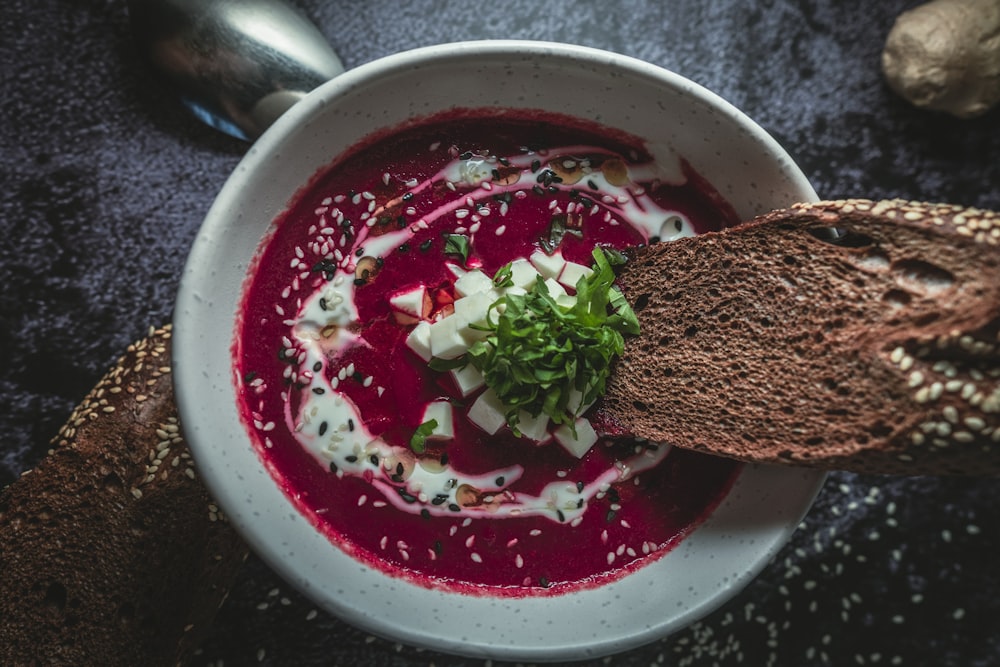 red and white ceramic bowl with red sauce