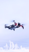 black and red drone flying