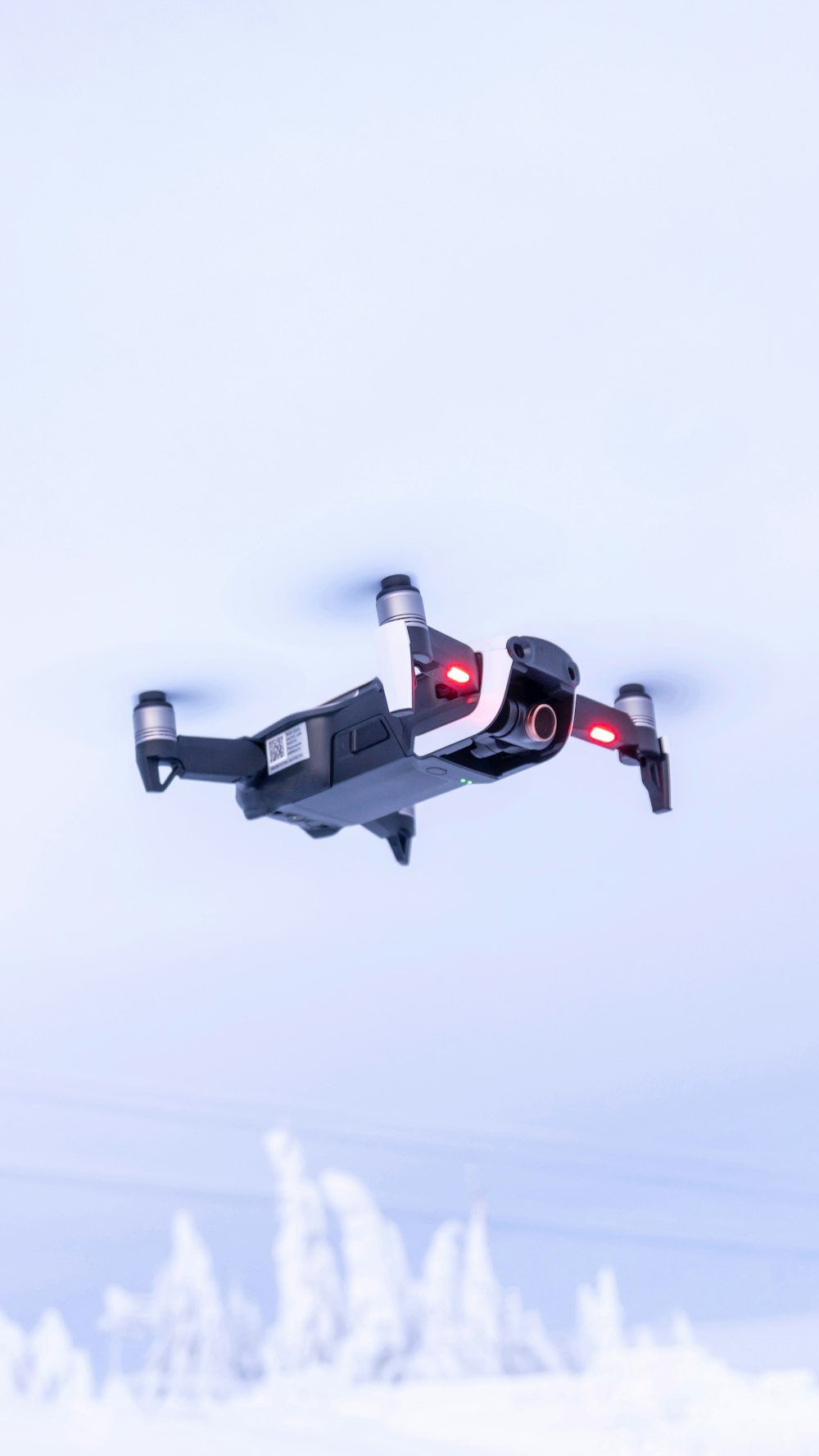 black and red drone flying