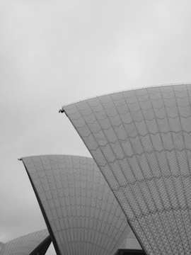 Geometric shapes overlaying an aerial photo of a building site.