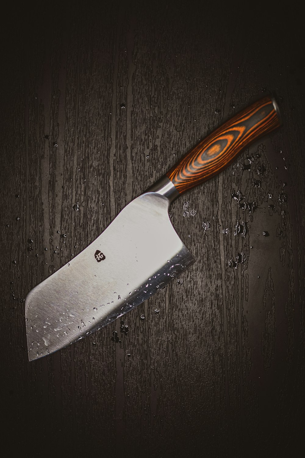 brown handle silver knife on brown wooden table