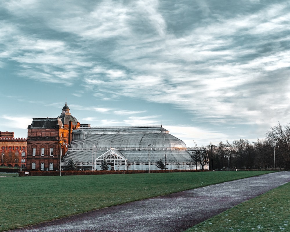 white and brown building under white clouds during daytime