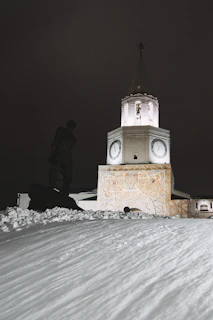 A shattered clock tower frozen at midnight, surrounded by debris and flickering embers.