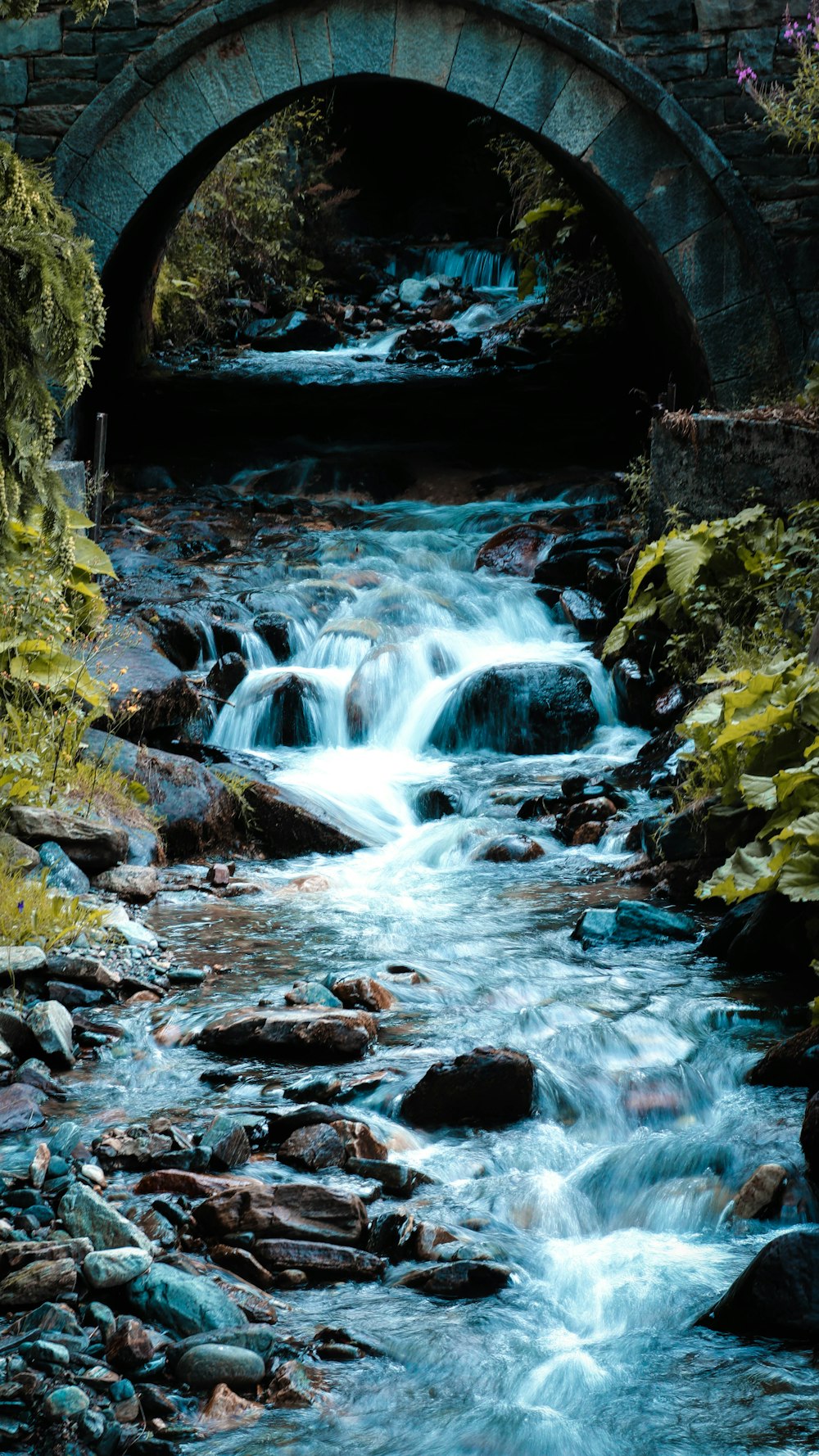 water falls in the middle of rocks