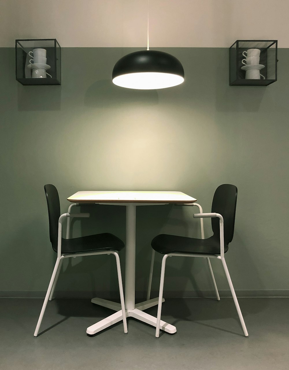 white wooden table and chairs