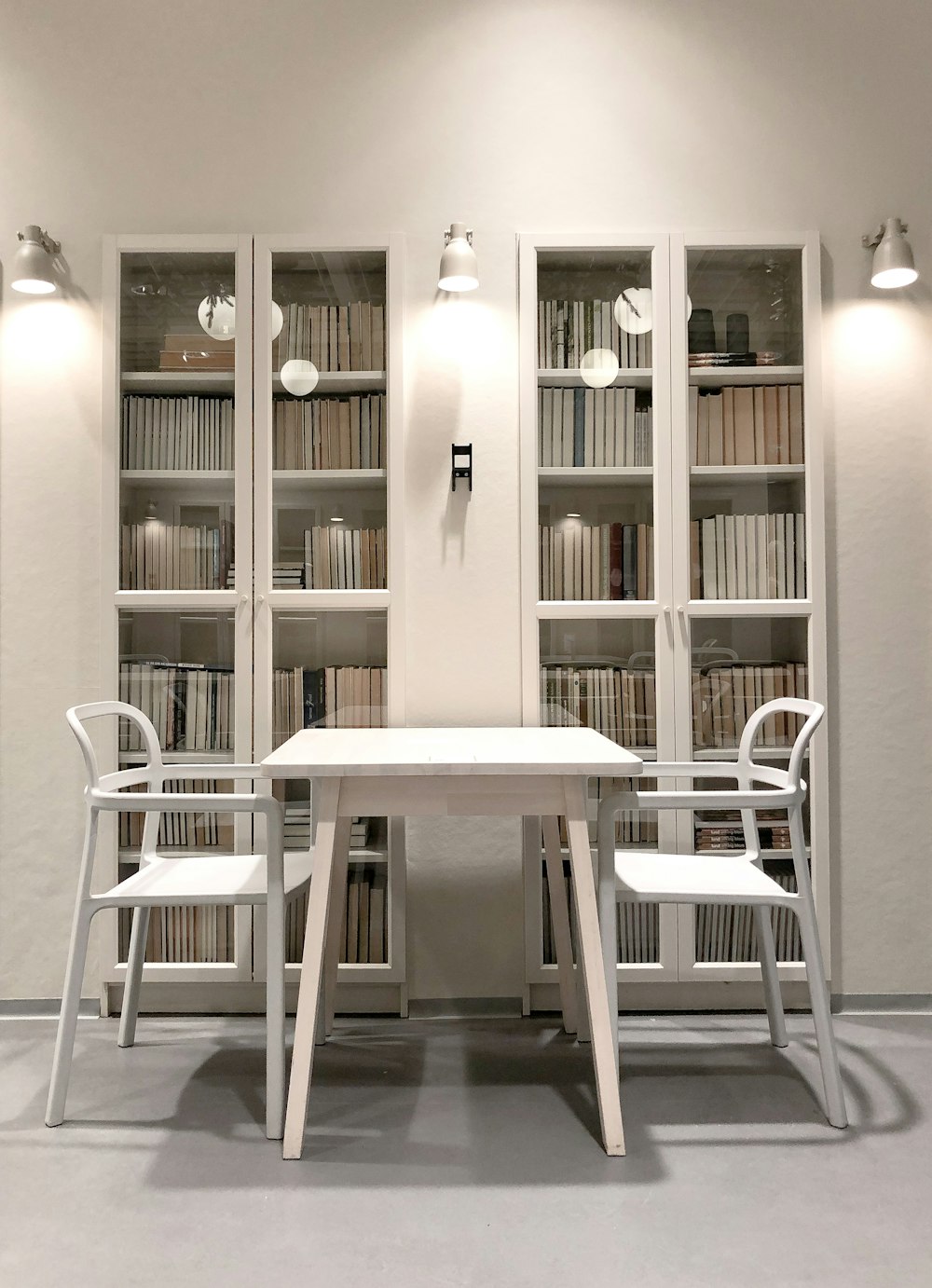 white wooden table and chairs