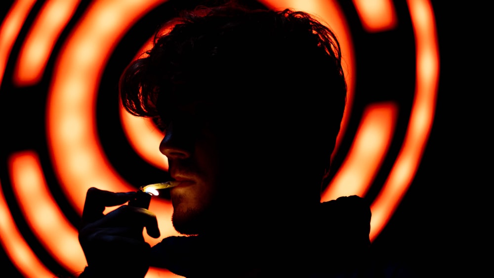 man in black shirt smoking