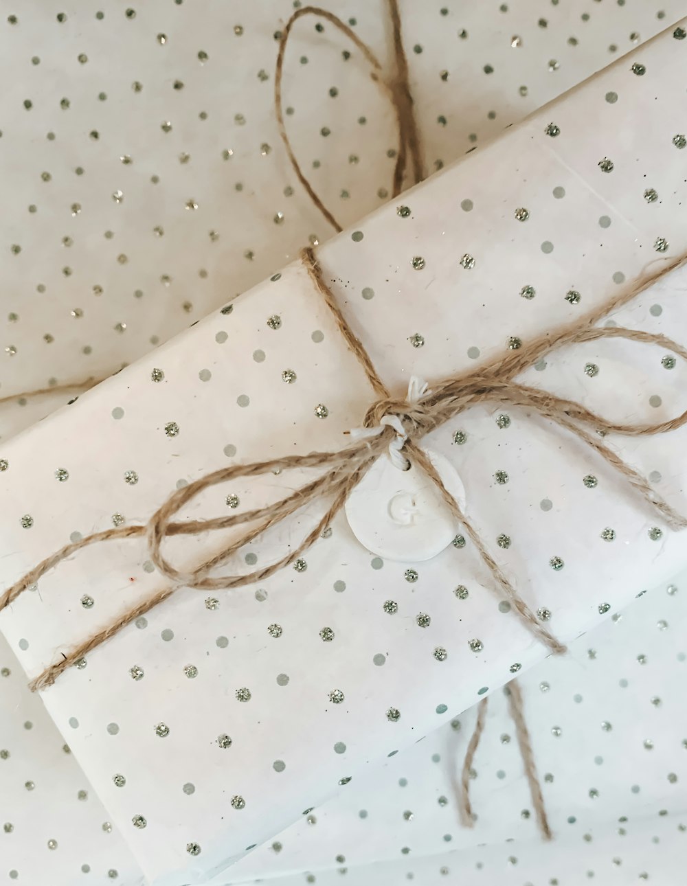 white and pink polka dot gift wrap