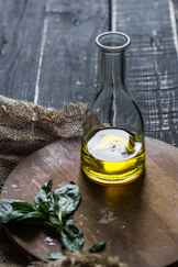 clear glass bottle with yellow liquid