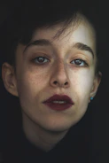 High-resolution portrait of a model in natural light, capturing raw emotion