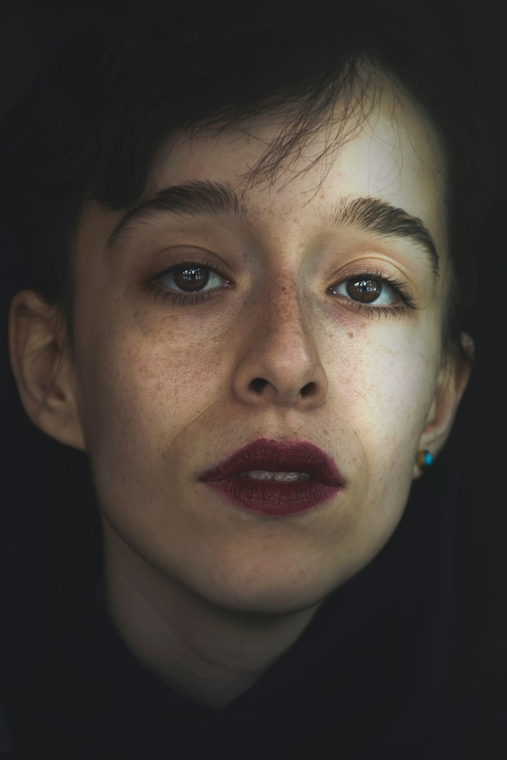 woman with red lipstick and blue eyes