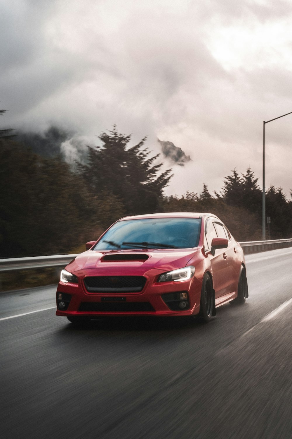 red car on road during daytime