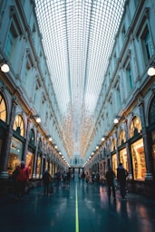 people walking on street between buildings during daytime