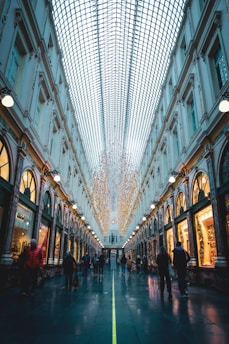 people walking on street between buildings during daytime