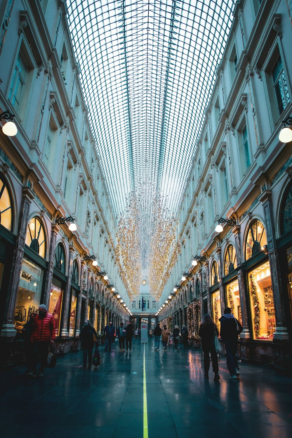 people walking on street between buildings during daytime