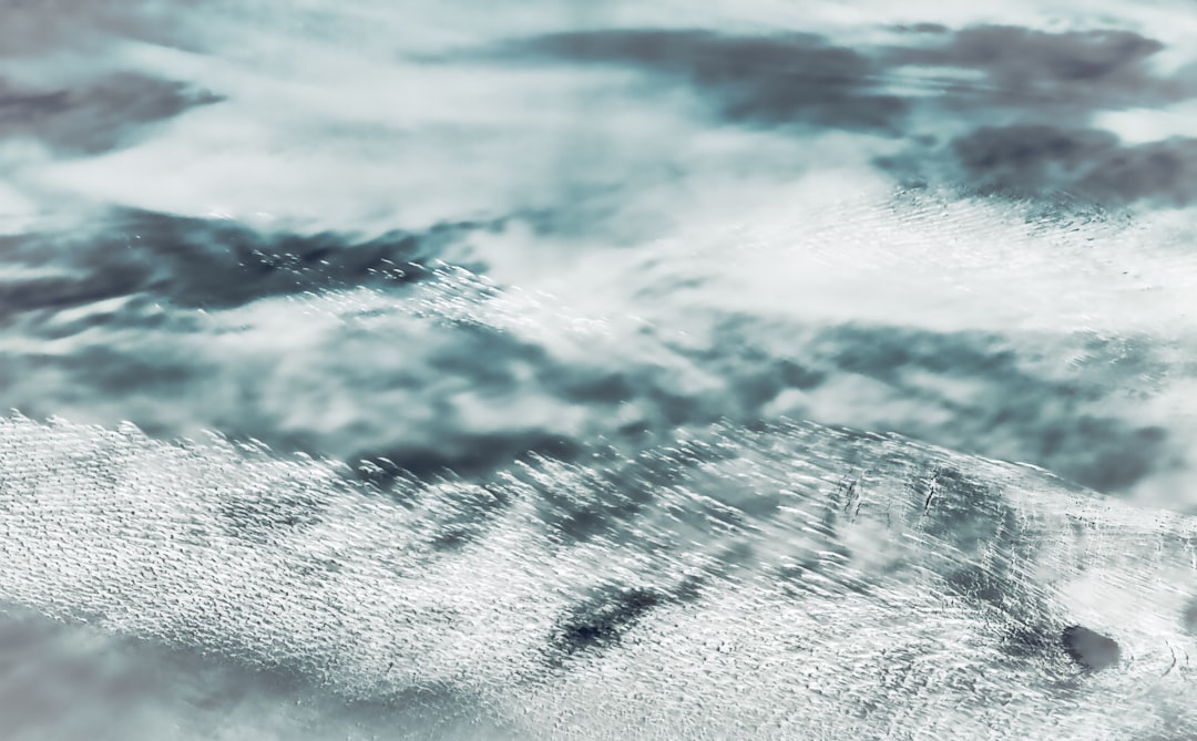 ocean waves crashing on shore during daytime