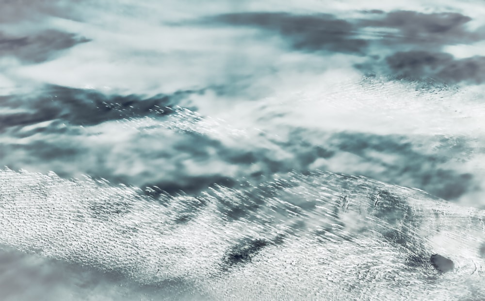 ocean waves crashing on shore during daytime