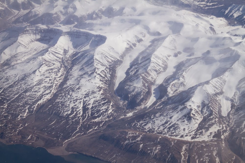 snow covered mountain during daytime