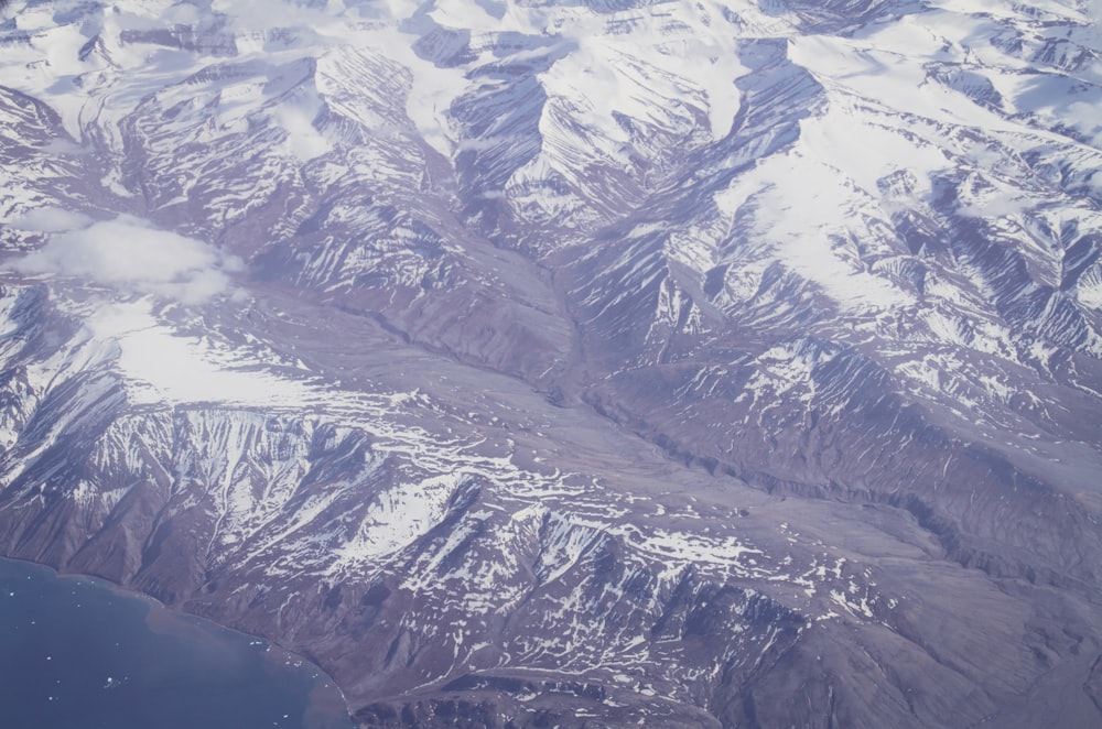 snow covered mountain during daytime