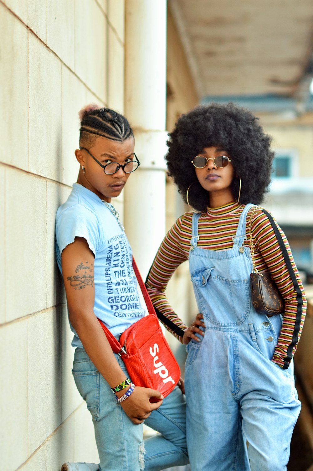 woman in blue denim dungaree with black sunglasses