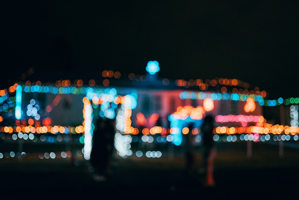 people walking on street during night time