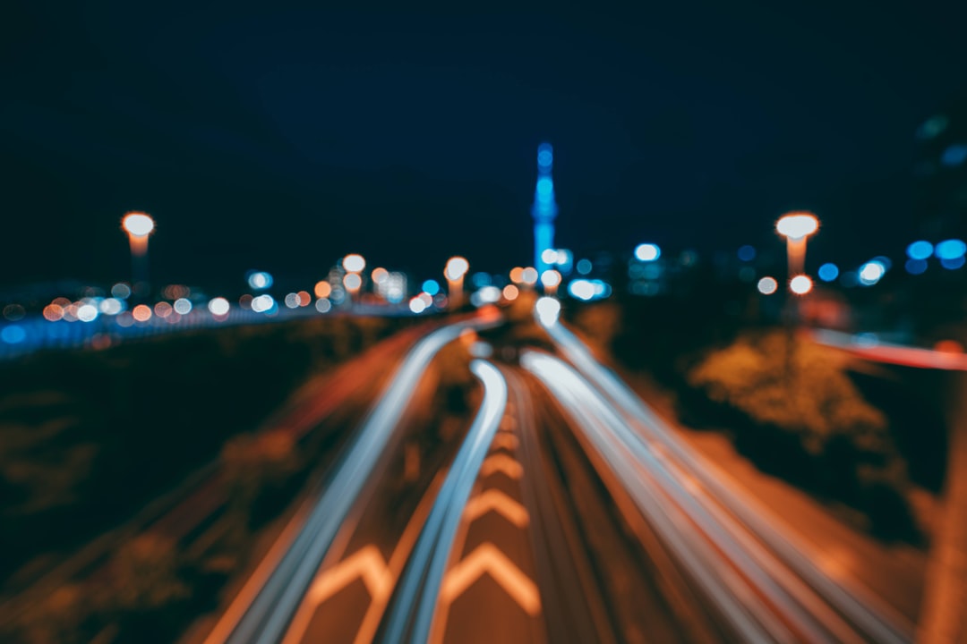 time lapse photography of cars on road during night time