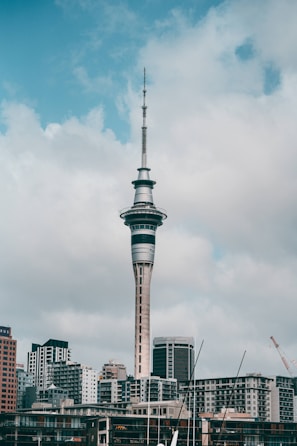 gray concrete tower under white clouds during daytime