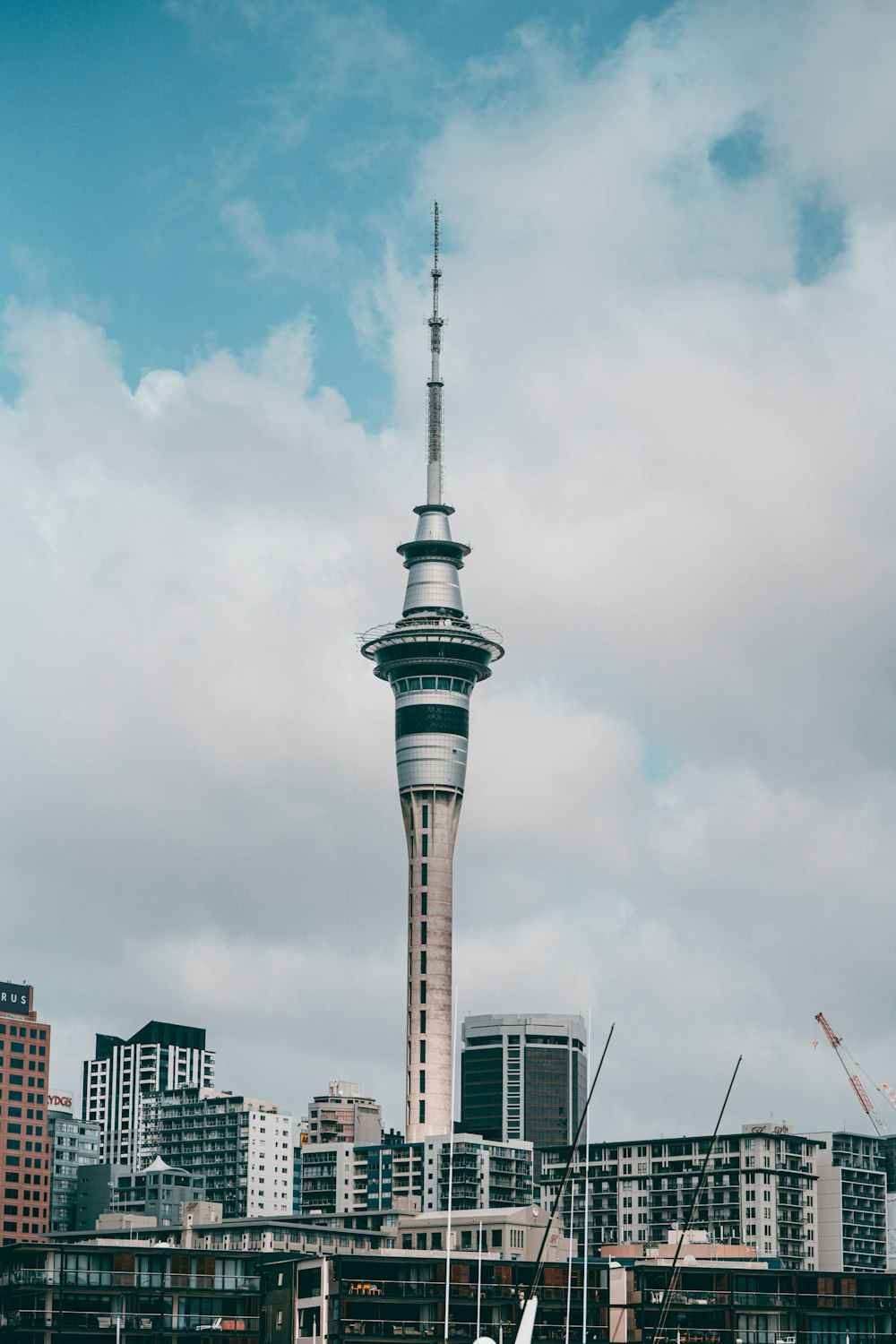 gray concrete tower under white clouds during daytime