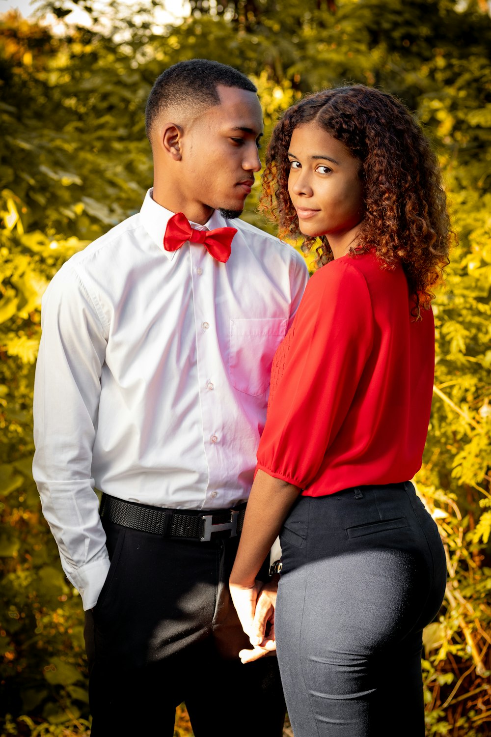 Woman in red long sleeve shirt and gray pants standing beside woman in  white dress shirt photo – Free Accessories Image on Unsplash
